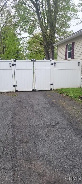 exterior space with fence and a gate