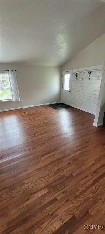 206 Oak St, Fulton, NY 13069 - interior space with vaulted ceiling, baseboards, and dark wood finished floors