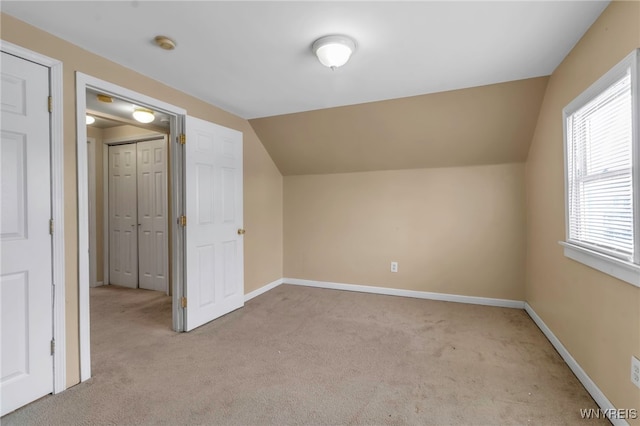 281 Roslyn Ave, Buffalo, NY 14215 - bonus room with light colored carpet, vaulted ceiling, and baseboards