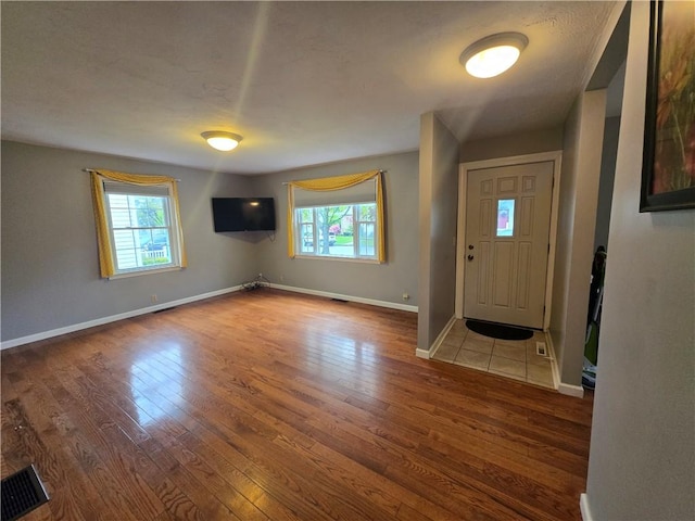 187 Cutler Ave, Corning-City, NY 14830 - foyer with baseboards, wood finished floors, and visible vents