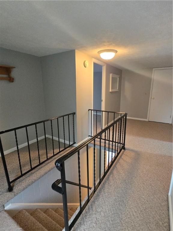 187 Cutler Ave, Corning-City, NY 14830 - staircase featuring baseboards and carpet flooring