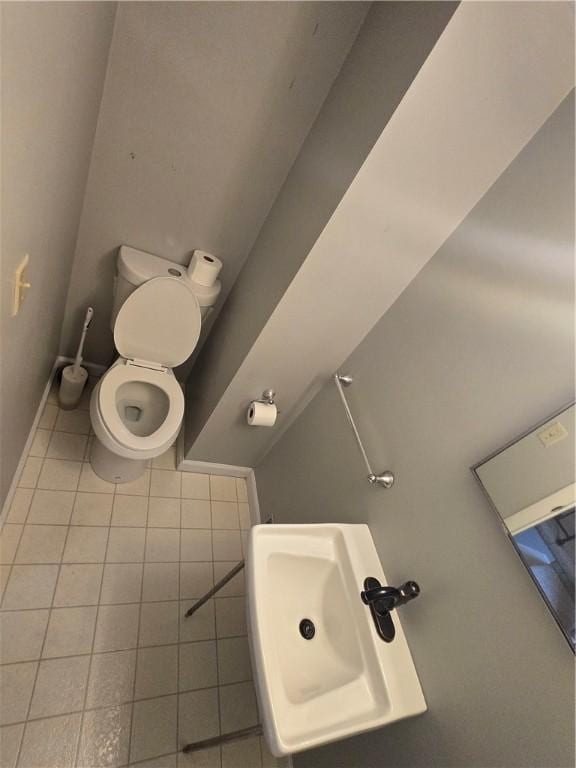 187 Cutler Ave, Corning-City, NY 14830 - bathroom with a sink, tile patterned floors, baseboards, and toilet