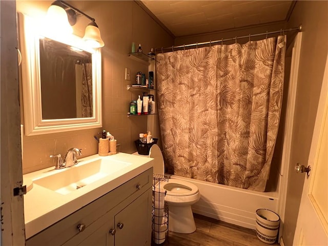 full bath featuring vanity, toilet, wood finished floors, and shower / tub combo with curtain