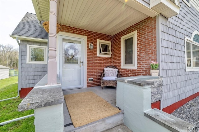 doorway to property with brick siding