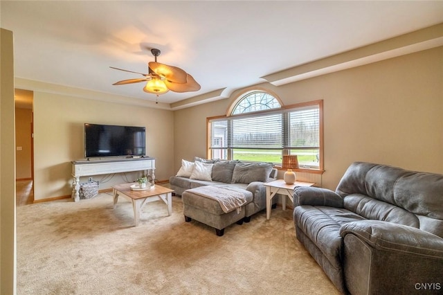 living area featuring ceiling fan and light carpet