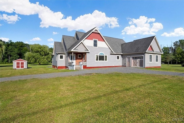 craftsman-style home with an outdoor structure, a front lawn, a shed, and gravel driveway