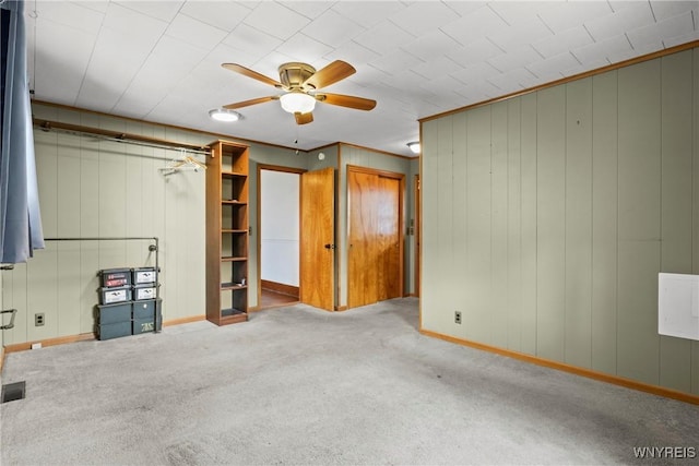 unfurnished bedroom featuring baseboards, visible vents, and carpet