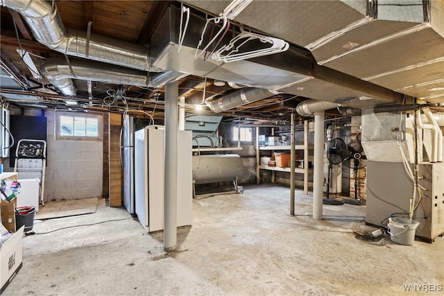 basement featuring heating unit and heating fuel