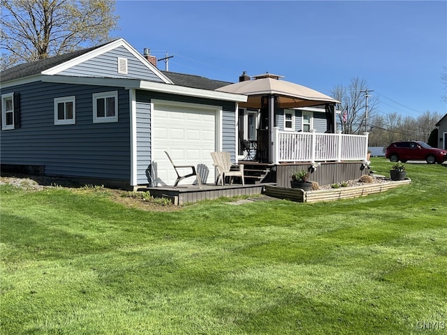 back of house featuring a chimney and a yard