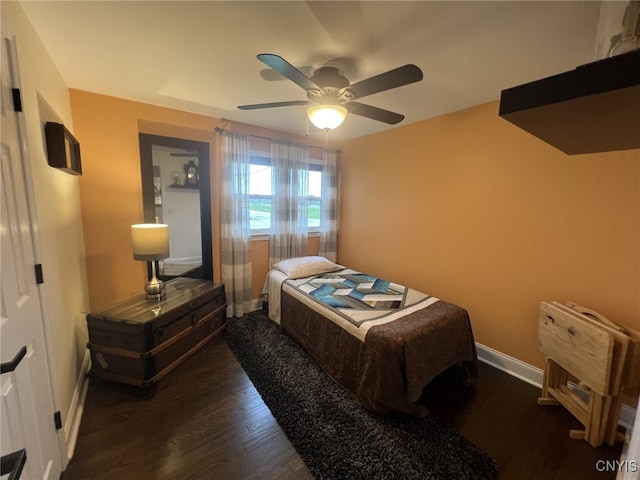 bedroom featuring baseboards, ceiling fan, and wood finished floors