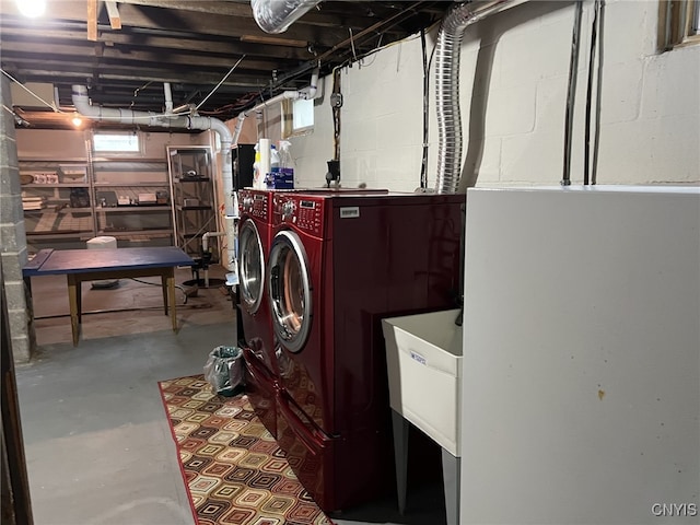 clothes washing area featuring laundry area and washing machine and clothes dryer