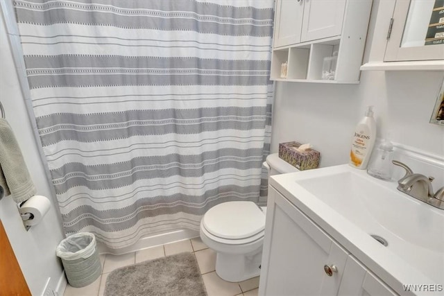 bathroom with tile patterned flooring, vanity, toilet, and a shower with curtain
