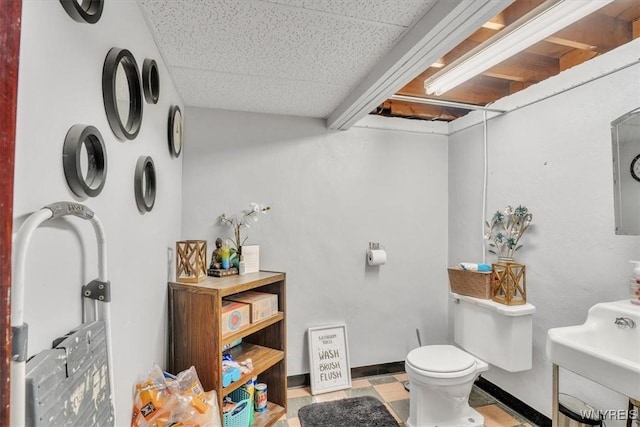 bathroom featuring a sink and toilet