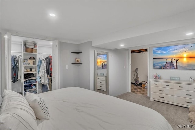 bedroom featuring recessed lighting, carpet flooring, a spacious closet, and a closet