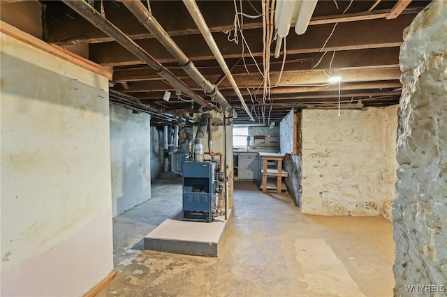 basement featuring a heating unit