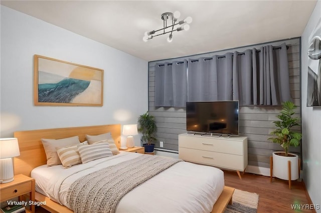 bedroom with wood finished floors