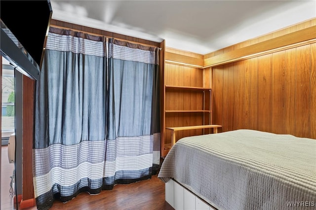 bedroom featuring wood finished floors
