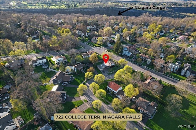 birds eye view of property with a residential view
