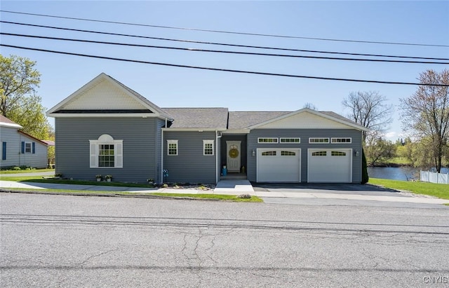 222 William St, Brownville, NY 13634 - single story home featuring an attached garage and aphalt driveway