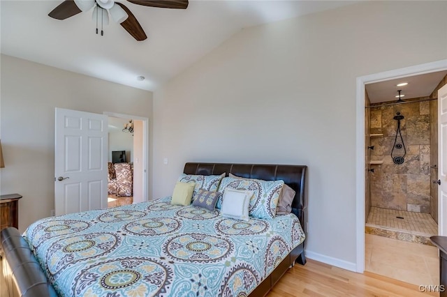 222 William St, Brownville, NY 13634 - bedroom with lofted ceiling, wood finished floors, baseboards, ensuite bathroom, and a ceiling fan
