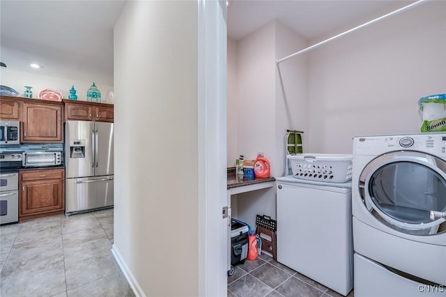 222 William St, Brownville, NY 13634 - washroom with laundry area, light tile patterned floors, washing machine and dryer, and a toaster
