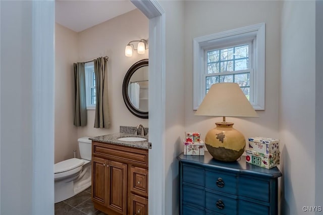 222 William St, Brownville, NY 13634 - bathroom with toilet, tile patterned flooring, and vanity