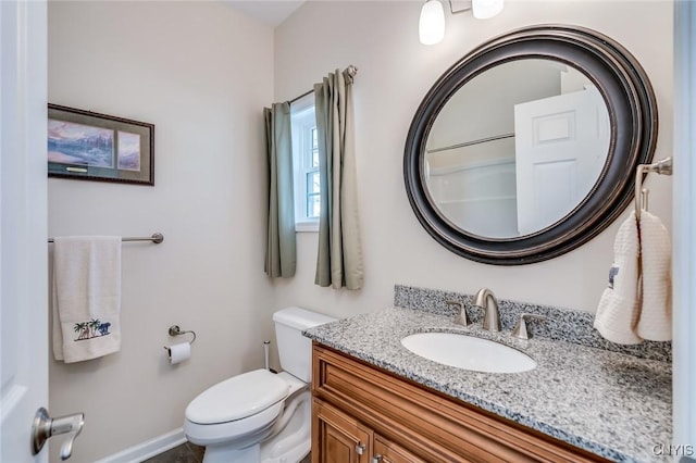 222 William St, Brownville, NY 13634 - bathroom featuring toilet, baseboards, and vanity