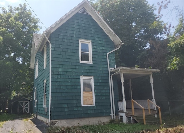 212 Mechanic St, Elmira City, NY 14904 - rear view of property featuring a shed