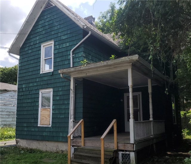 212 Mechanic St, Elmira City, NY 14904 - view of front of property with a chimney
