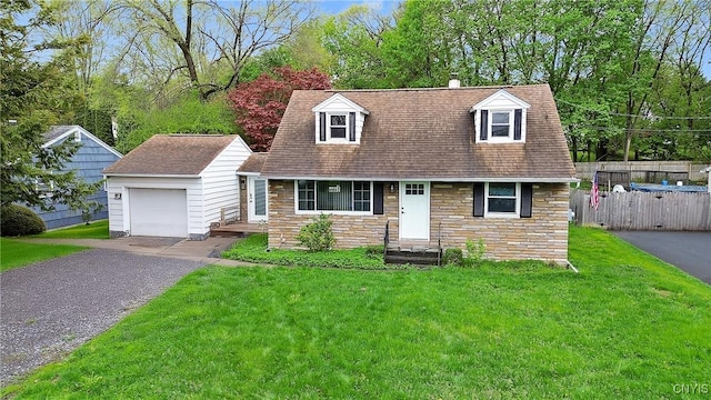 504 Beverly Dr, Camillus, NY 13219 - new england style home with fence, stone siding, a front yard, an outbuilding, and driveway