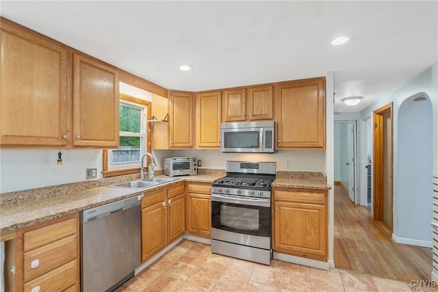 504 Beverly Dr, Camillus, NY 13219 - kitchen featuring recessed lighting, a sink, appliances with stainless steel finishes, and a toaster