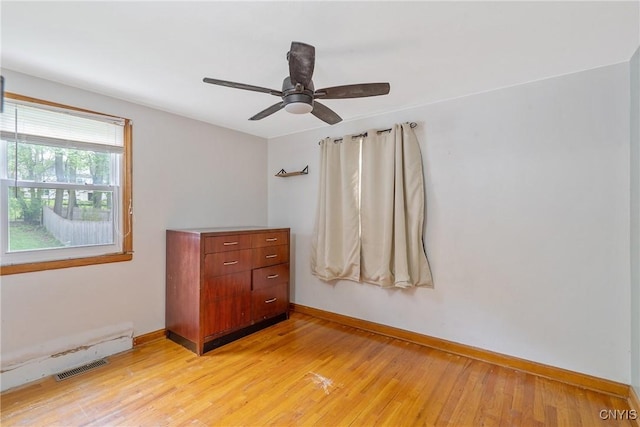 504 Beverly Dr, Camillus, NY 13219 - empty room featuring visible vents, light wood finished floors, ceiling fan, and baseboards