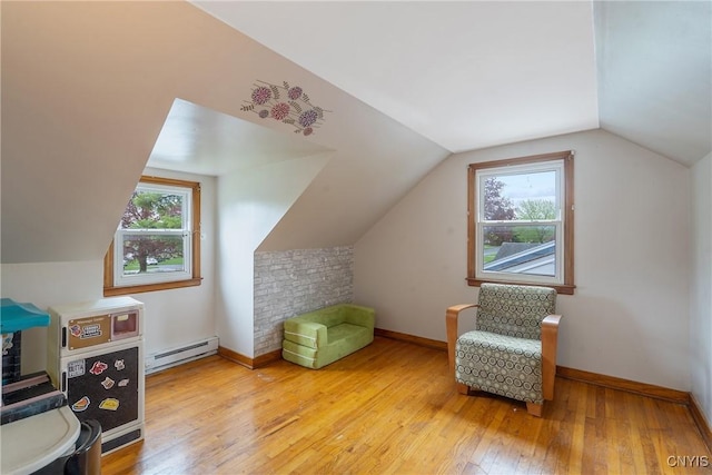 504 Beverly Dr, Camillus, NY 13219 - bonus room with baseboards, a baseboard heating unit, hardwood / wood-style flooring, and a wealth of natural light