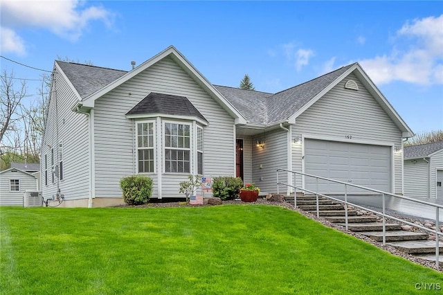ranch-style house with a garage, a front yard, roof with shingles, central AC unit, and driveway