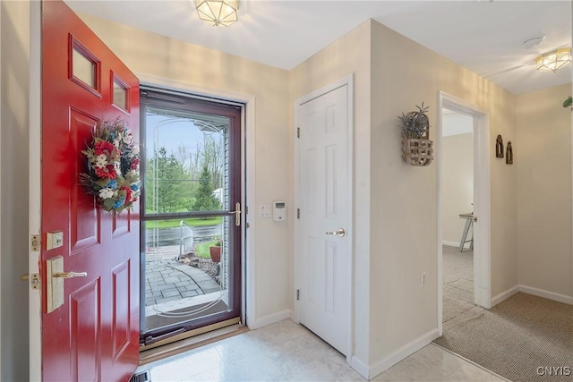 foyer entrance with baseboards