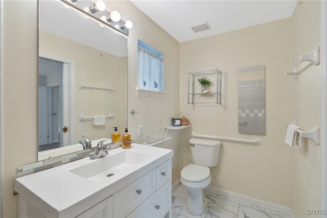bathroom with visible vents, vanity, marble finish floor, toilet, and baseboards