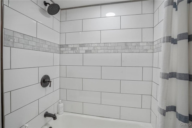 bathroom with shower / bath combination with curtain