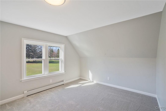 additional living space featuring baseboards, a baseboard heating unit, carpet flooring, and lofted ceiling