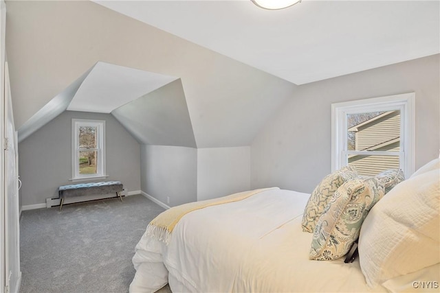 carpeted bedroom with baseboards and vaulted ceiling