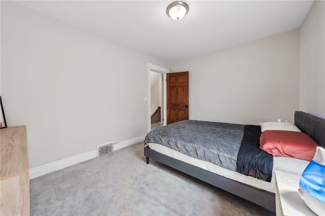 bedroom with visible vents, baseboards, and carpet floors