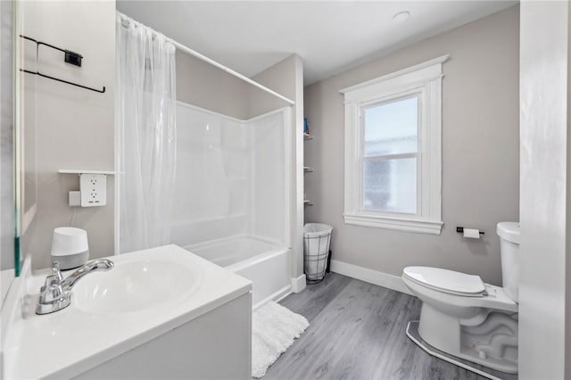 full bath featuring toilet, baseboards, vanity, shower / bathtub combination with curtain, and wood finished floors