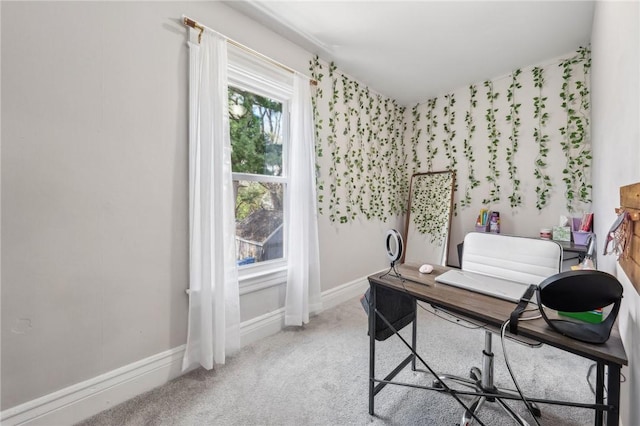 home office featuring light carpet and baseboards