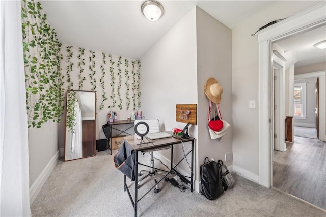 carpeted office space with baseboards