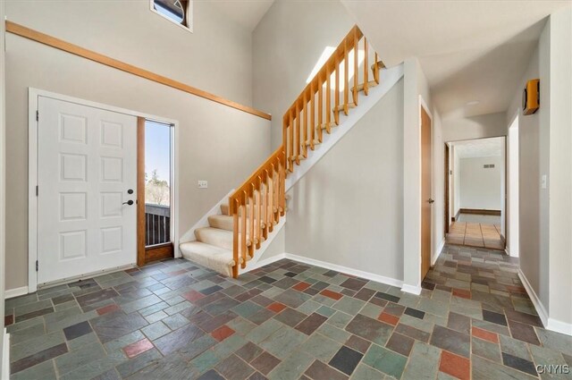 3578 S St, Kirkland, NY 13323 - foyer with stairs, baseboards, and stone tile flooring