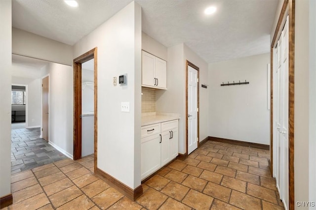 3578 S St, Kirkland, NY 13323 - hall with baseboards, recessed lighting, and stone tile flooring