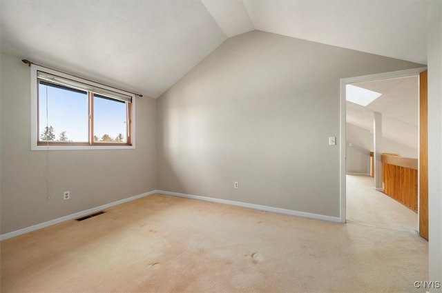 3578 S St, Kirkland, NY 13323 - empty room with baseboards, light carpet, visible vents, and vaulted ceiling