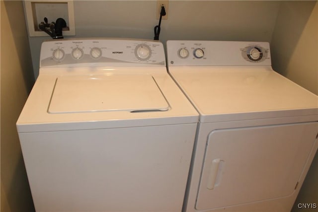 washroom featuring washer and clothes dryer