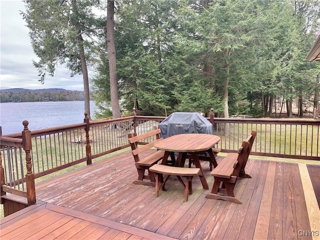 5048 State Route 28, Webb, NY 13420 - deck featuring a water view, a view of trees, and outdoor dining space