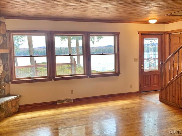 5048 State Route 28, Webb, NY 13420 - foyer with a water view, wooden ceiling, visible vents, and stairs