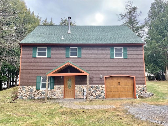 5048 State Route 28, Webb, NY 13420 - view of front of house featuring stone siding, an attached garage, a shingled roof, a front lawn, and driveway
